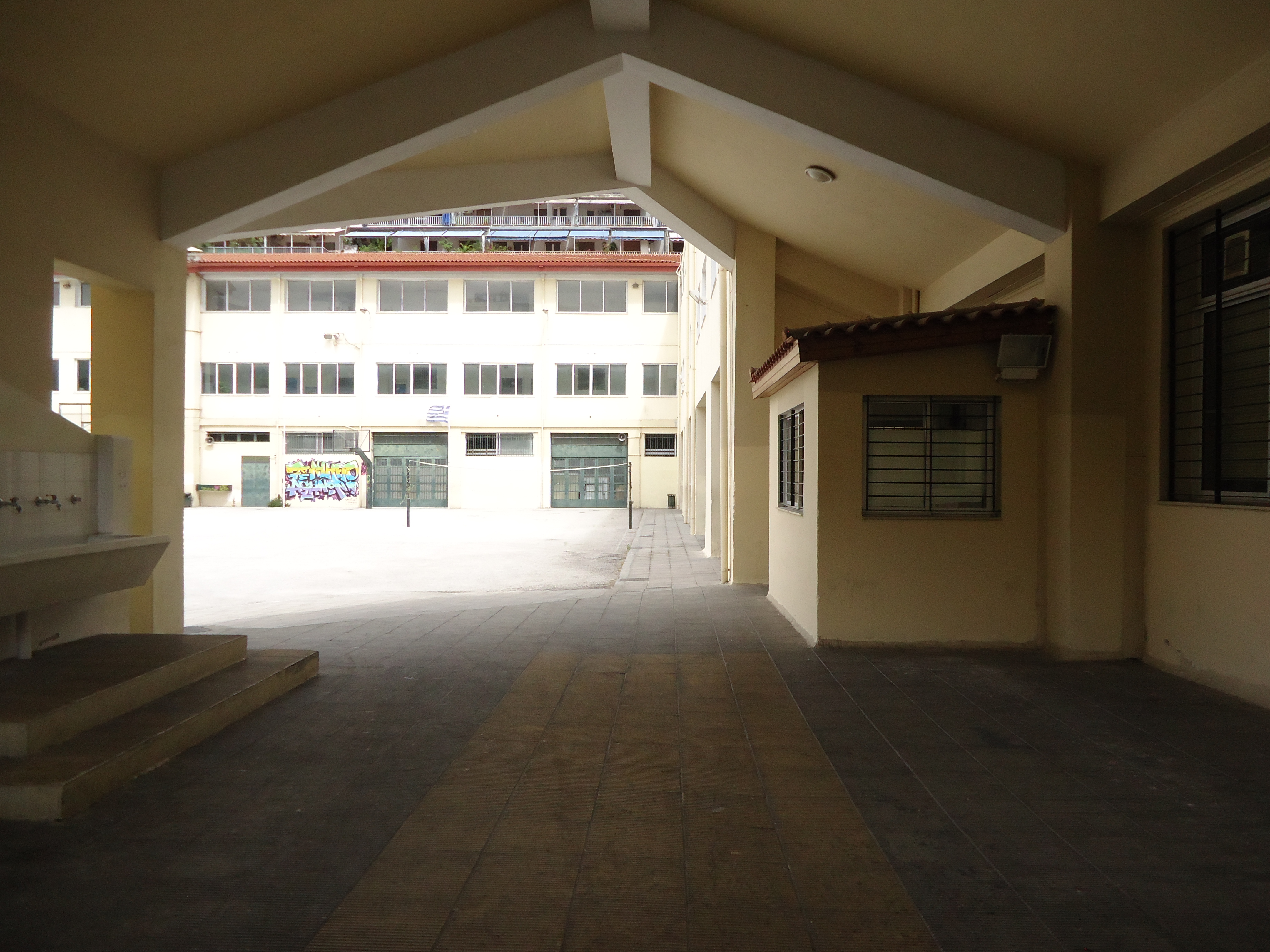 View of entrance to the open space of the gymnasium - lyceum from Merkouri Spirou str.