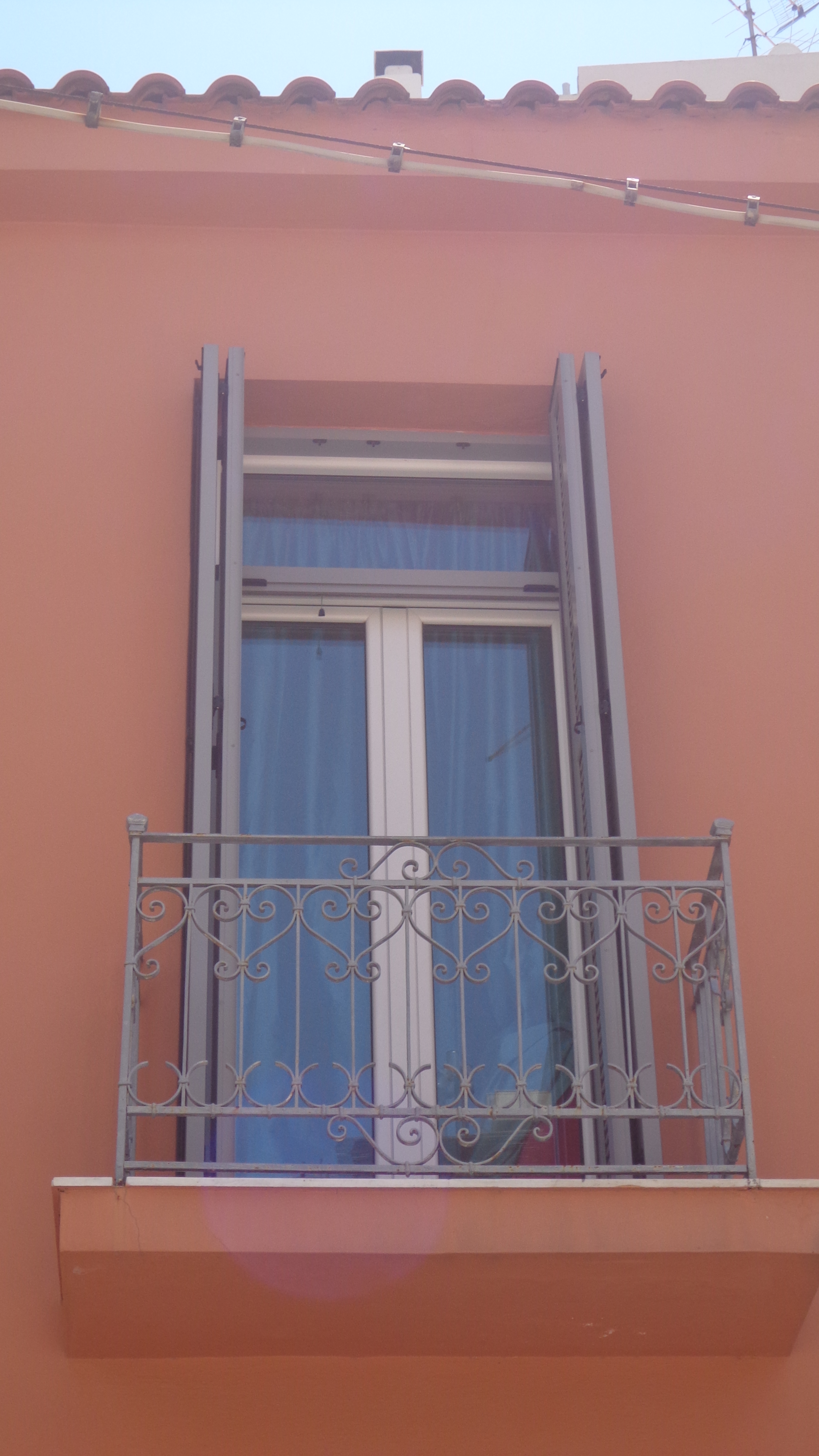 Symmetric balcony with railings.